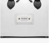 White Italian leather handbag with black handles and refined gold-tone hardware